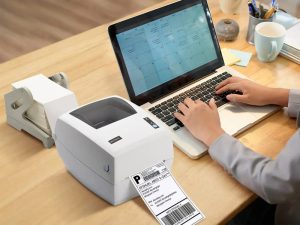 Thermal Shipping Label Printer and Macbook on table